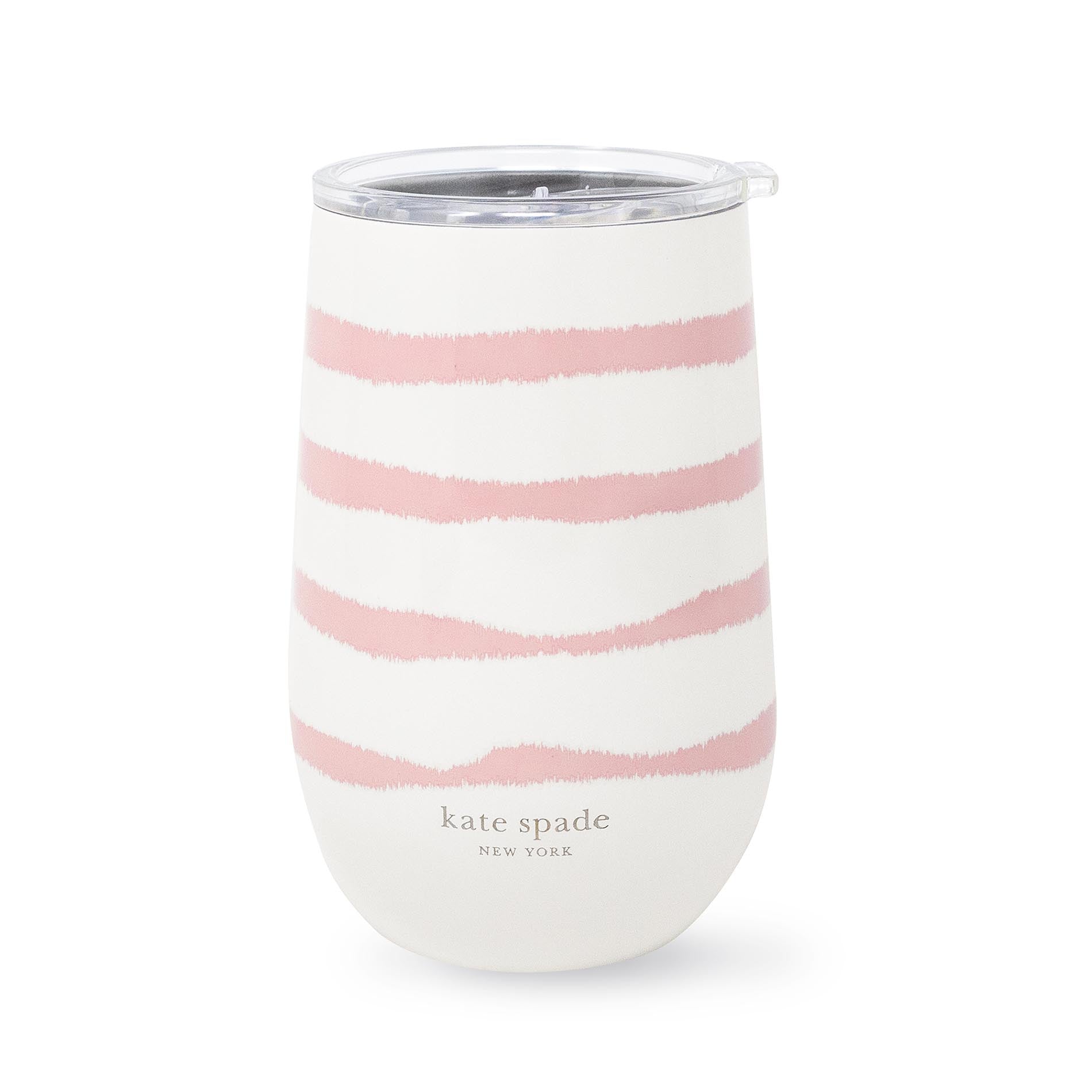 White tumbler with pink stripes and 'kate spade New York' branding on a white background