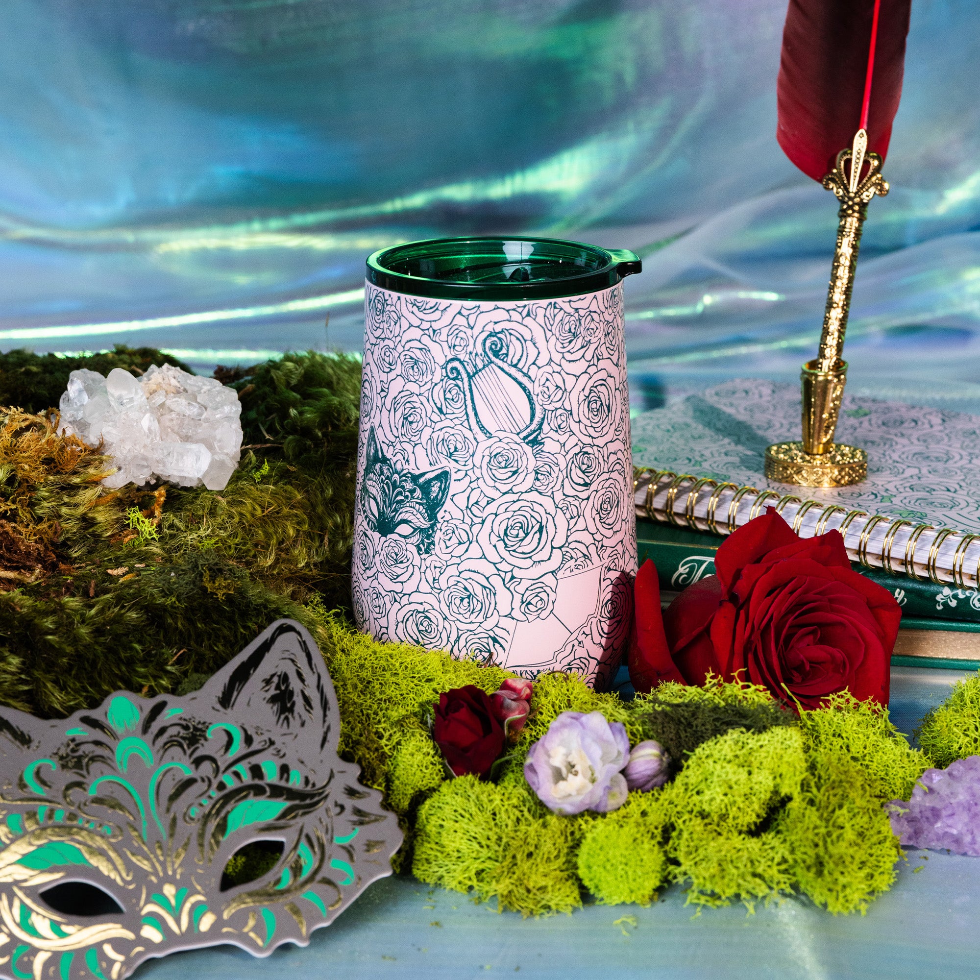 Pink tumbler with rose and butterfly design with a rose and moss background