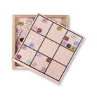 Sudoku game with wooden box on a white background
