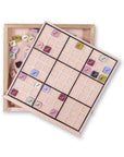 Sudoku game with wooden box on a white background