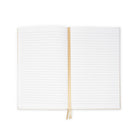 lined interior of cream and metallic gold vertical stripe notebook with gold elastic closure and gold satin placeholder