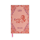 A pink zodiac-themed notebook or journal featuring a red and purple lion illustration and the text 'LEO' and 'THE LION' on the cover, with a pink ribbon bookmark hanging from the bottom.