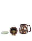 Tea mug with infuser and decorative elements on a white background