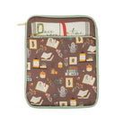 brown book sleeve with colorful cozy book nook icons