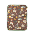 back view of brown book sleeve with colorful cozy book nook icons