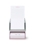 Notebook with a green and white striped holder on a white background
