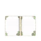 A lined planner with a decorative floral border and a gold spiral binding, shown open on a plain white background.