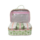 An open green and white patterned travel organizer bag with pink trim, containing four matching zippered pouches, shown on a white background.