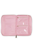 Pink travel organizer with clear front pocket on a white background