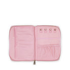 Pink travel organizer with multiple compartments on a white background