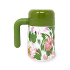 Floral-patterned mug with green handle and lid on a white background