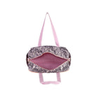 A duffel bag with a black and white abstract patterned exterior, a pink interior lining, and light pink straps, shown against a plain white background.