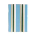 A notebook with a light blue cover featuring vertical stripes in dark green, white, and gold, shown against a plain white background.