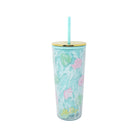 Tumbler with floral design and straw on a white background