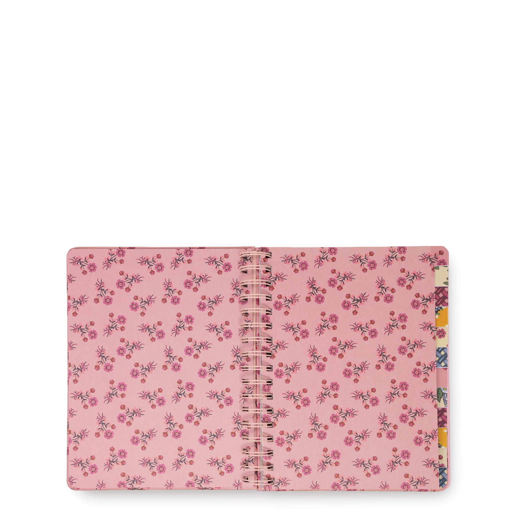A pink spiral notebook with a dense floral pattern of small pink, red, and purple flowers with green leaves, shown open on a plain white background.