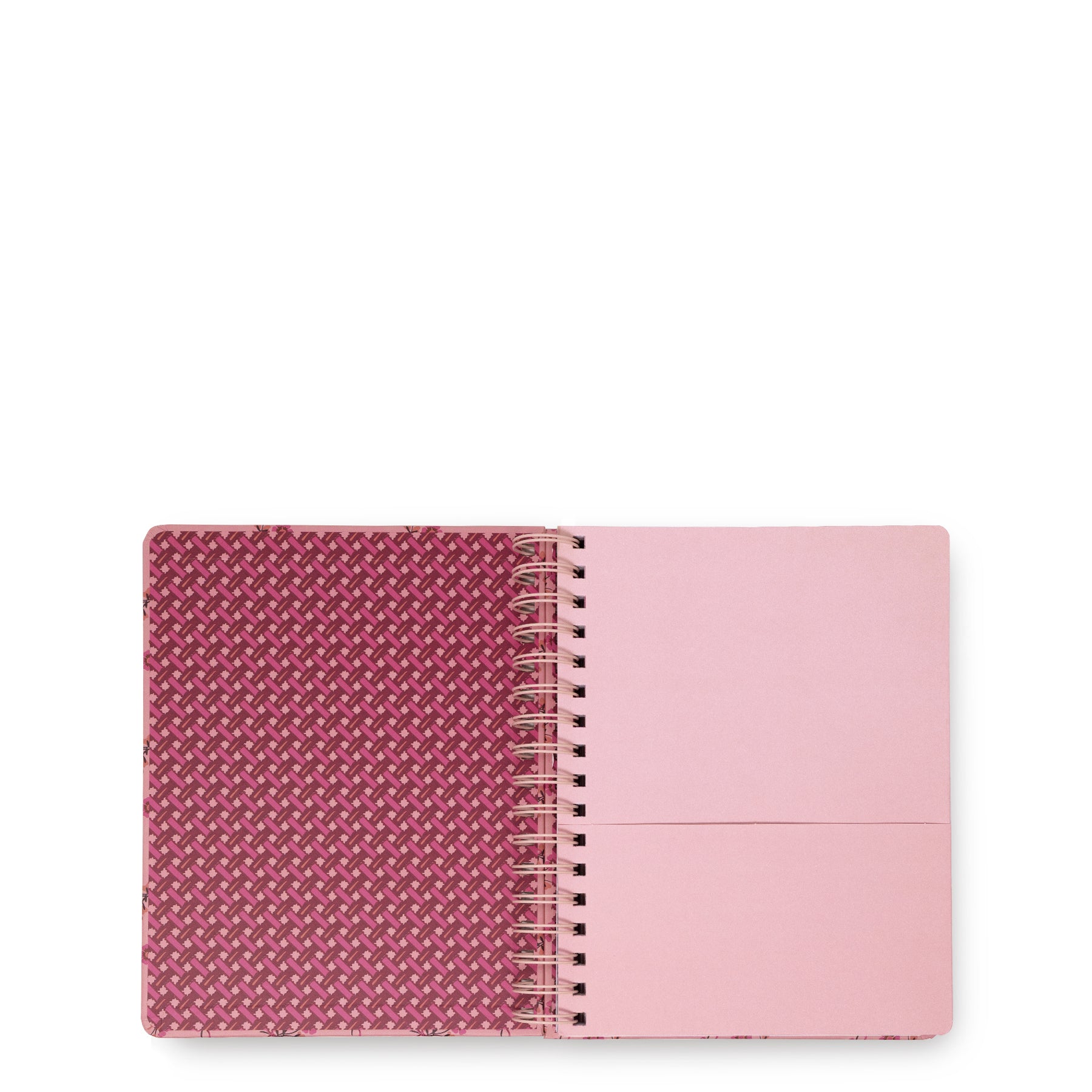 A spiral-bound notebook shown open on a plain white background. The left page has a textured magenta and white geometric pattern, while the right page is a solid light pink with a horizontal fold line.