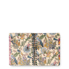 A spiral-bound notebook with a detailed vintage-style bird and floral pattern on a cream-colored cover, shown against a plain white background.