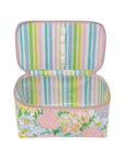Colorful striped interior of floral patterned makeup bag with pink accents on a white background