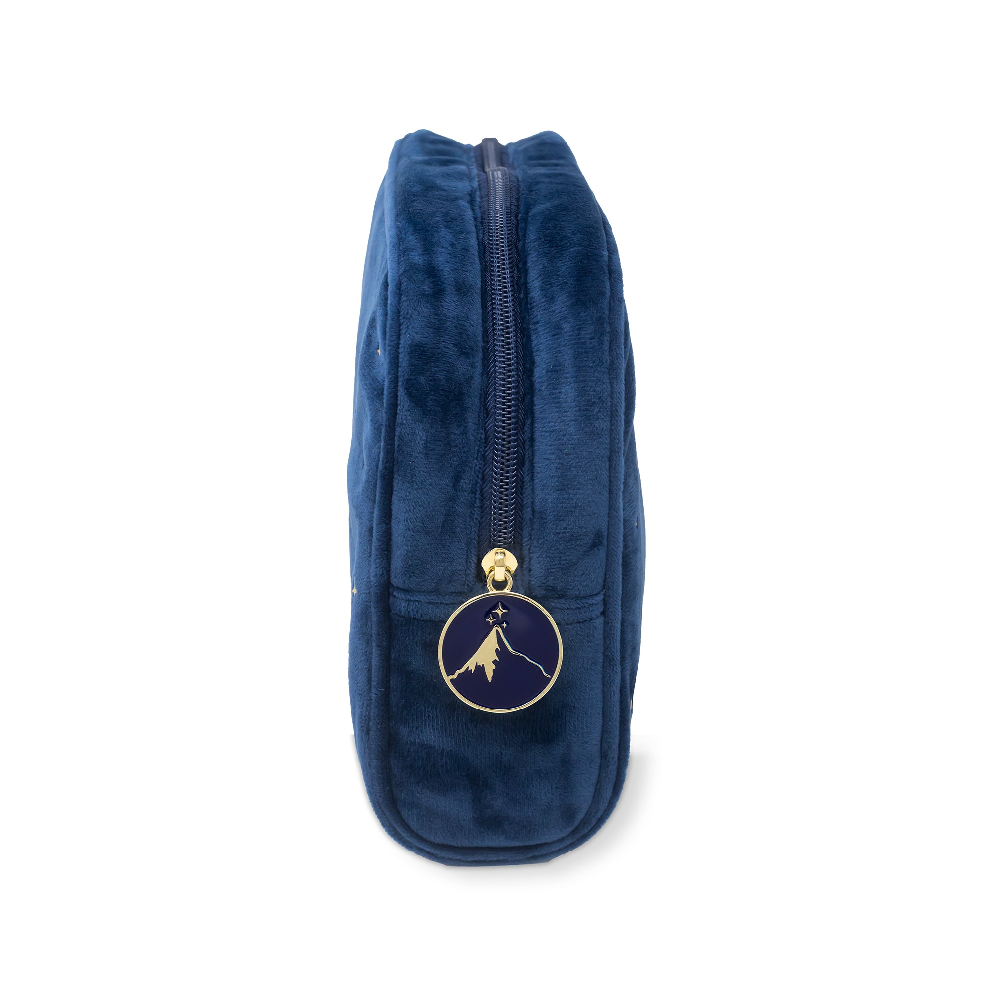 Blue velvet pouch with a gold zipper and emblem on a white background