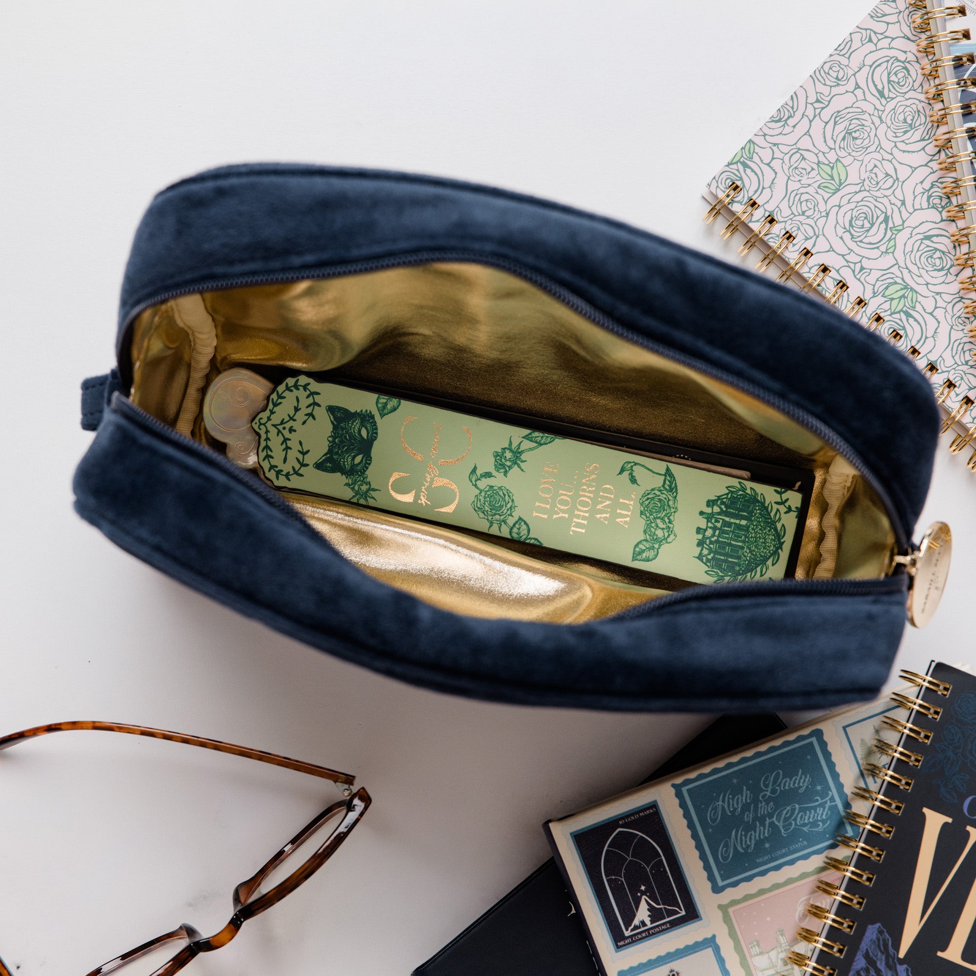 gold interior of blue velvet pouch