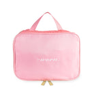 Pink travel bag with 'worn.' text on a white background
