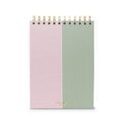 Two spiral-bound notebooks with pink and green striped patterns on a white background