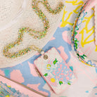 Colorful lanyard with floral design on a patterned surface