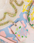 Colorful lanyard with floral design on a patterned surface