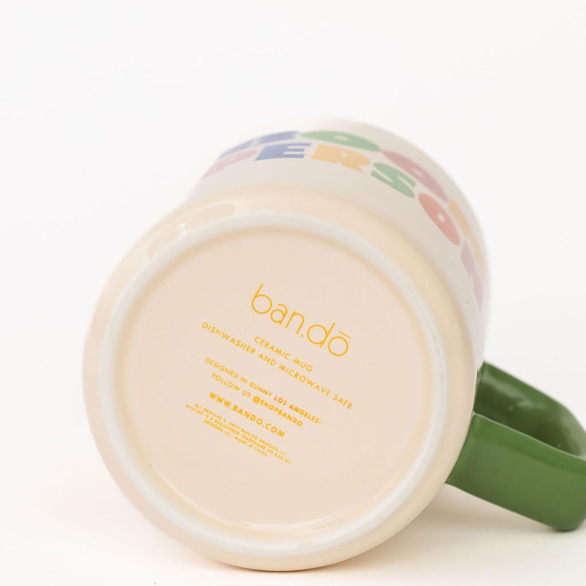 Mug with colorful design and 'ban.do' branding on a white background