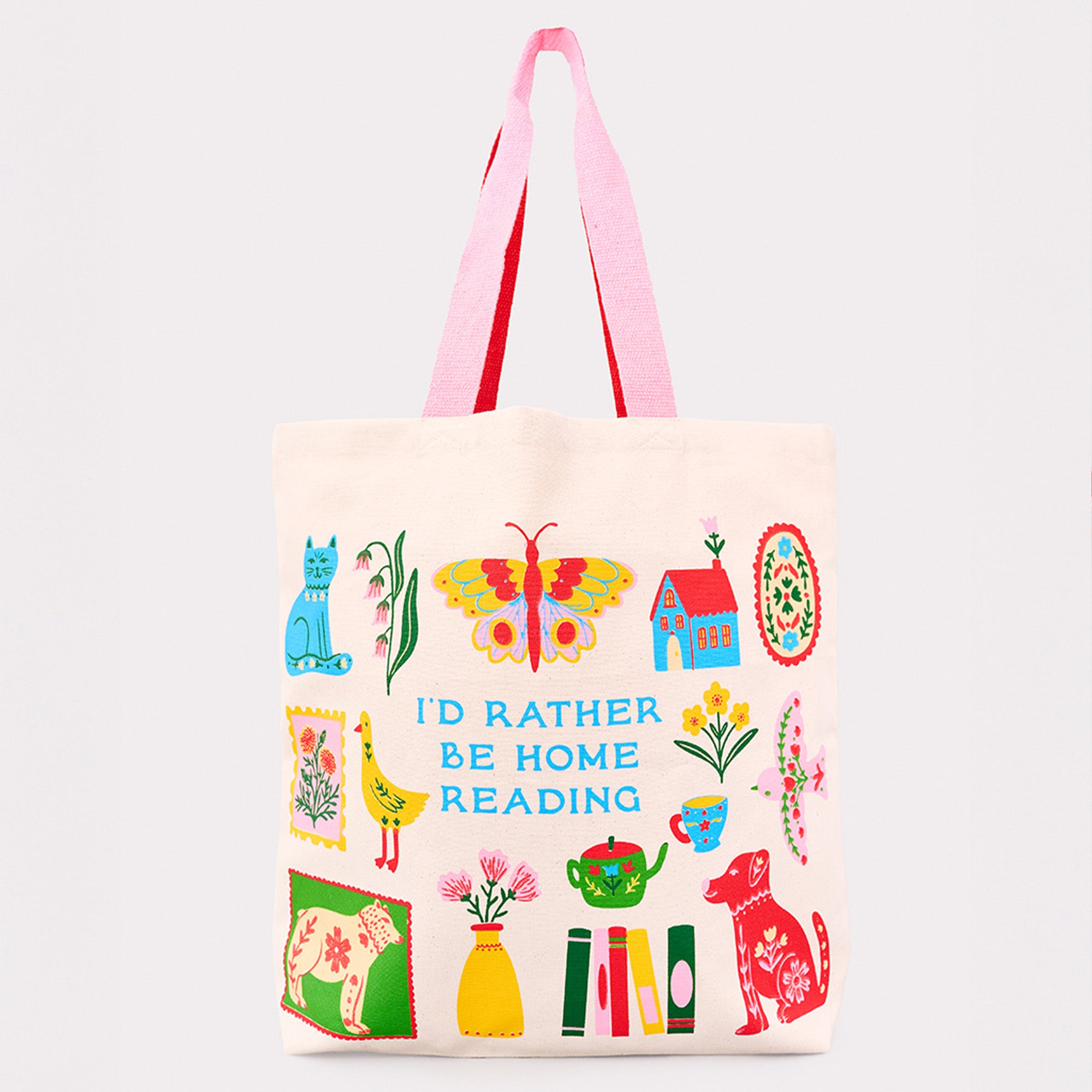 cream tote bag with colorful icon graphic that says 'i'd rather be home reading'