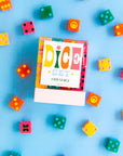 Dice set packaging with colorful dice around on a blue background