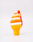 Glass sculpture of a candy corn design on a white background