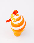 Ice cream ornament with orange and white design on a white background