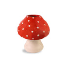 Mushroom-shaped vase with red cap and white polka dots on a beige stem against a white background