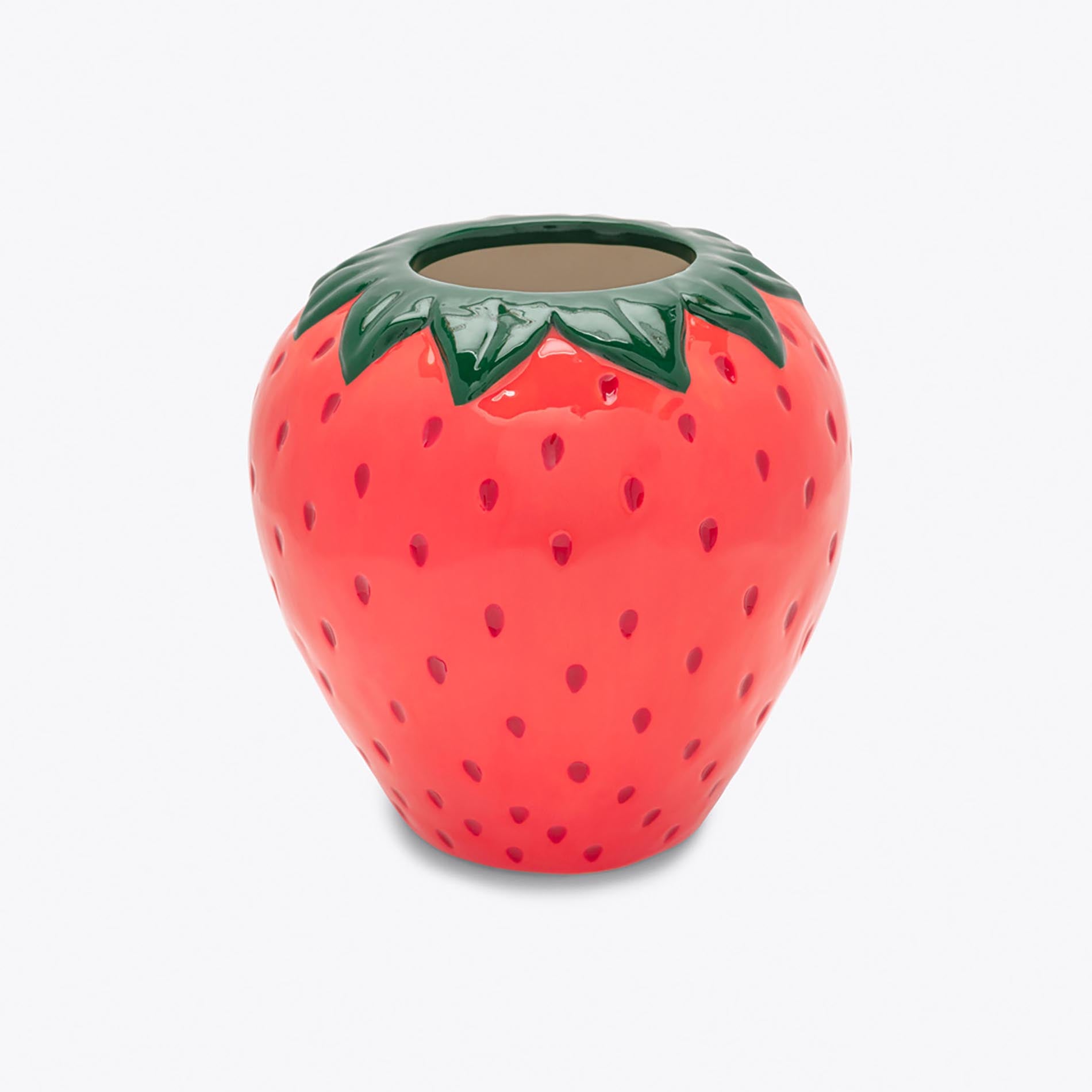 Ceramic strawberry-shaped container on a white background