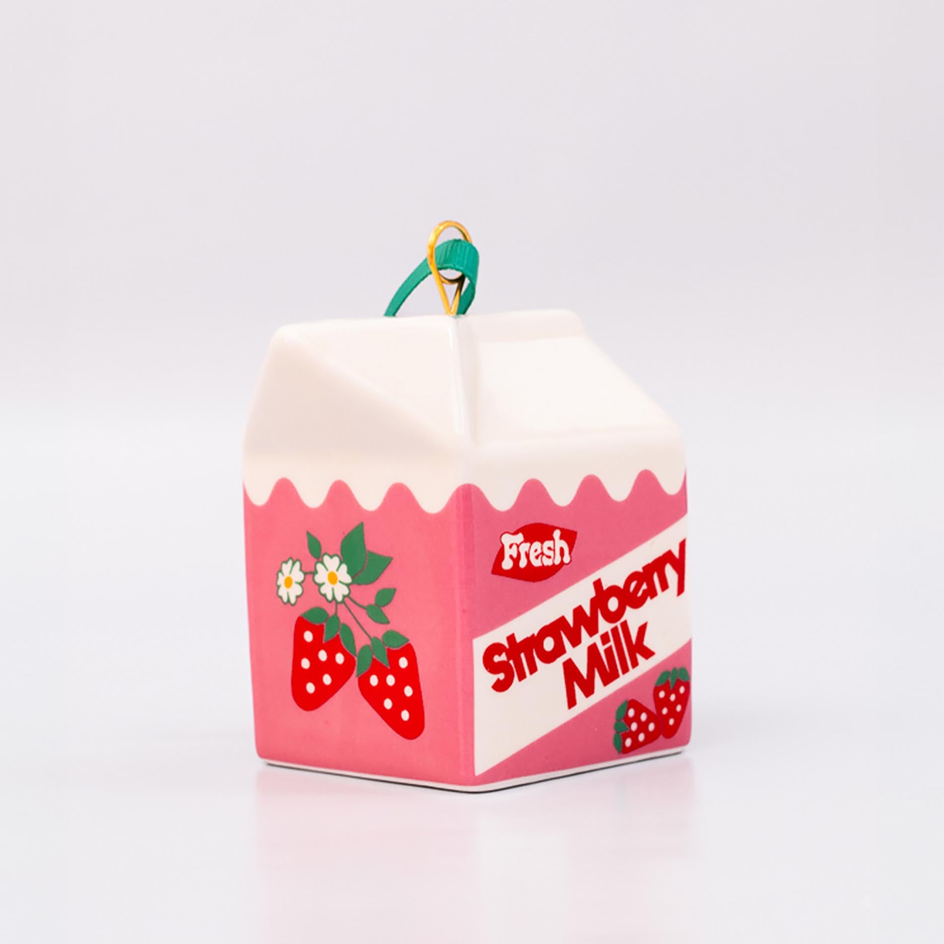 Strawberry milk carton-shaped ornament on a white background
