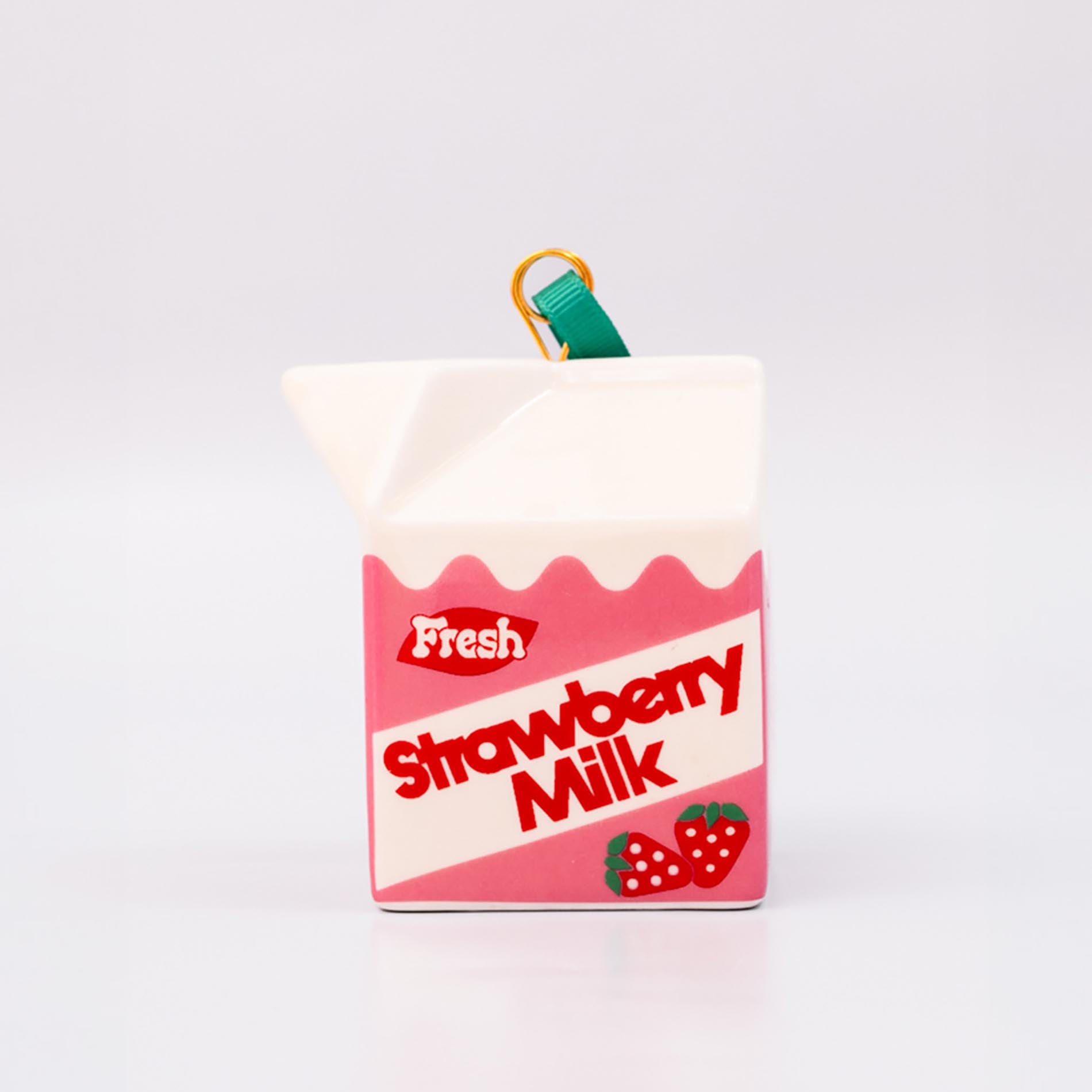 Strawberry milk carton-shaped ornament on a white background