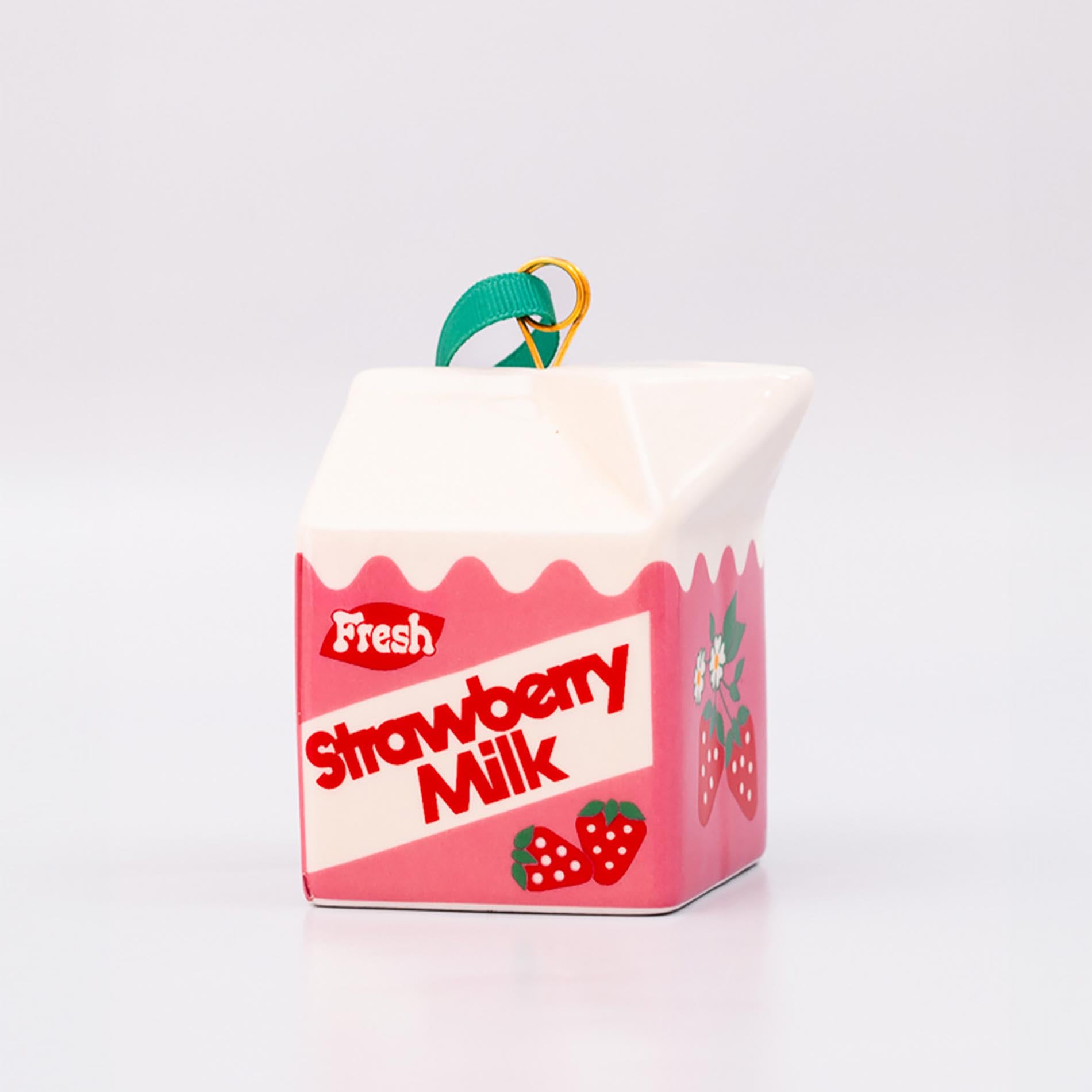 Strawberry milk carton-shaped ornament on a white background
