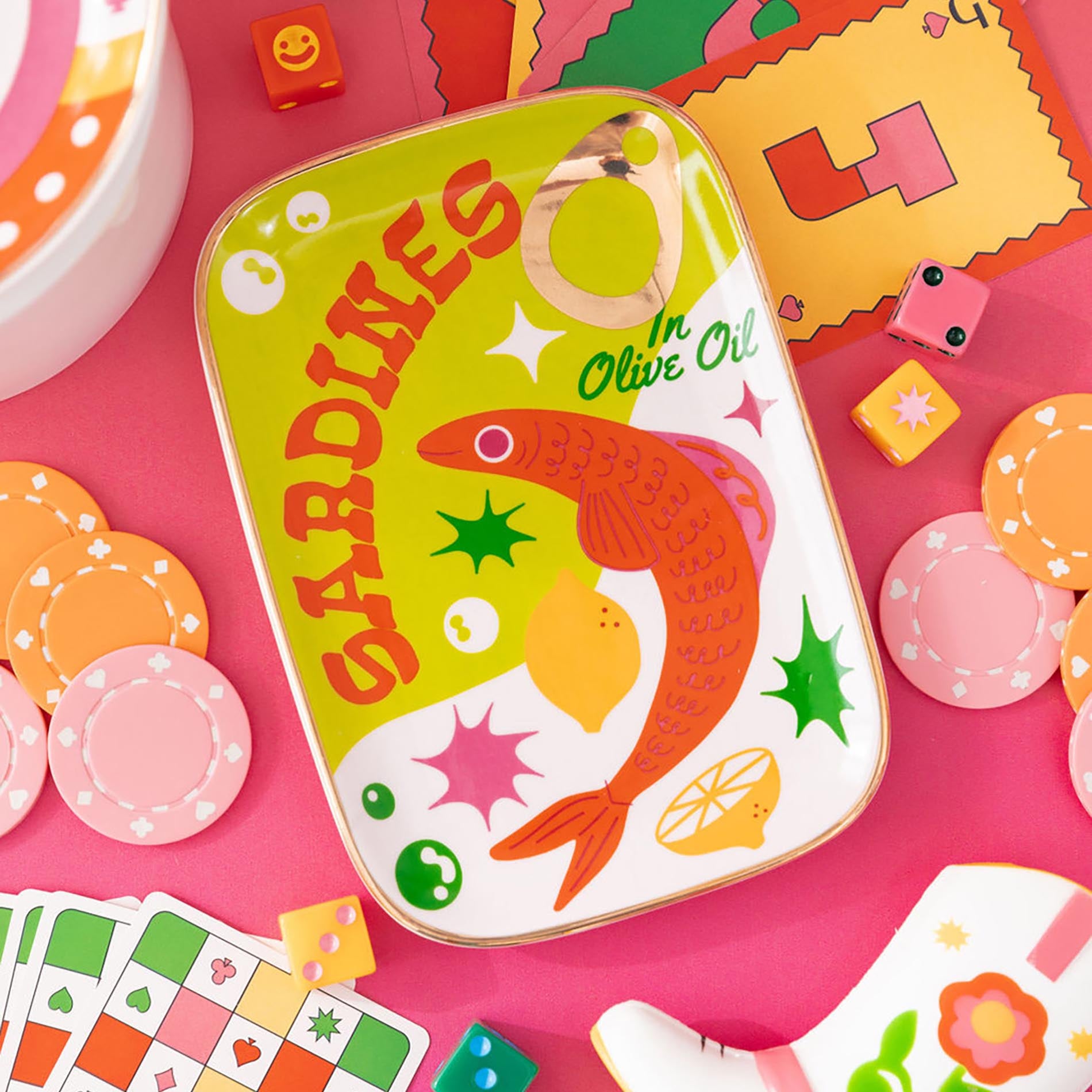 Colorful sardine ceramic tray on a colorful background