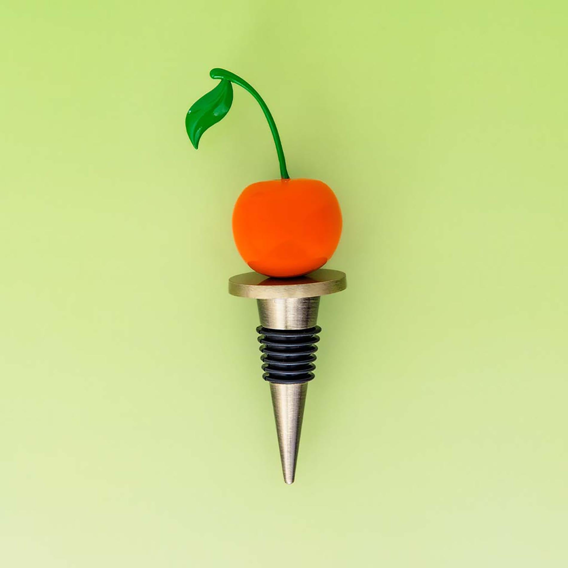 Wine bottle stopper with cherry design on a green background