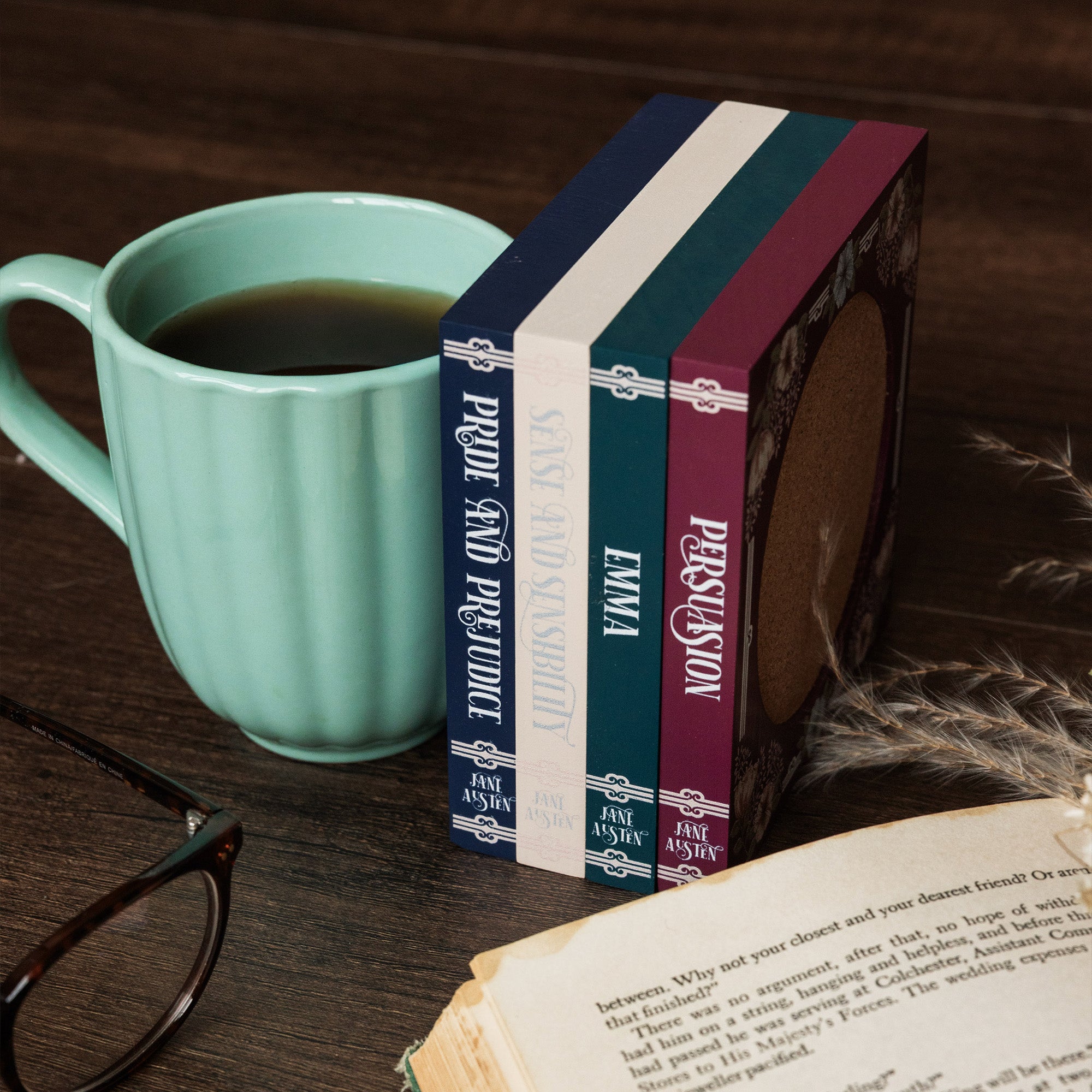 Floral-patterned coasters with jane austen book titles on the side