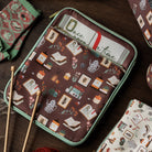 brown book sleeve with colorful cozy book nook icons on a table
