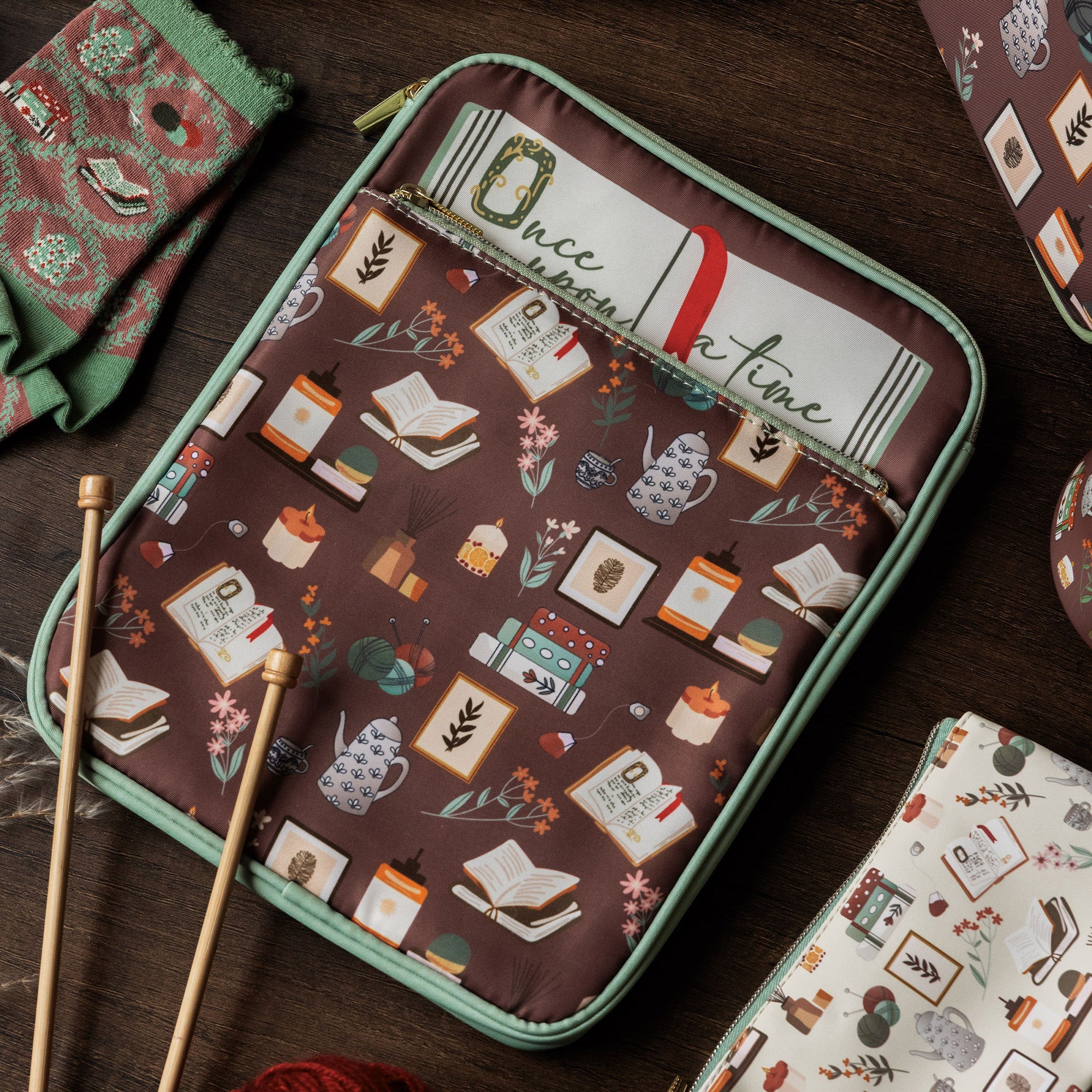 brown book sleeve with colorful cozy book nook icons on a table