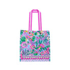 Colorful tote bag with floral and animal pattern on a white background