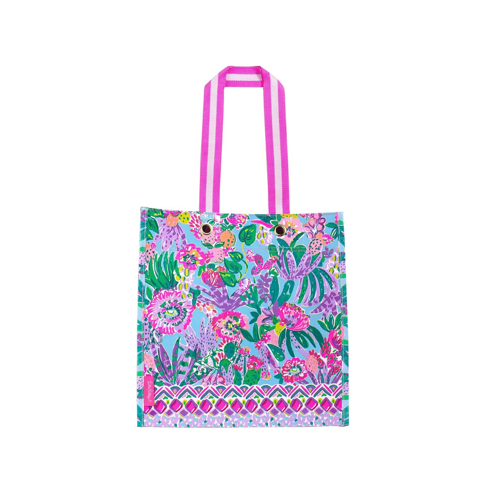 Colorful tote bag with floral and animal pattern on a white background