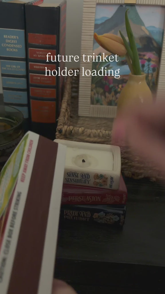 model showcasing stacked book candle