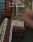 model showcasing stacked book candle