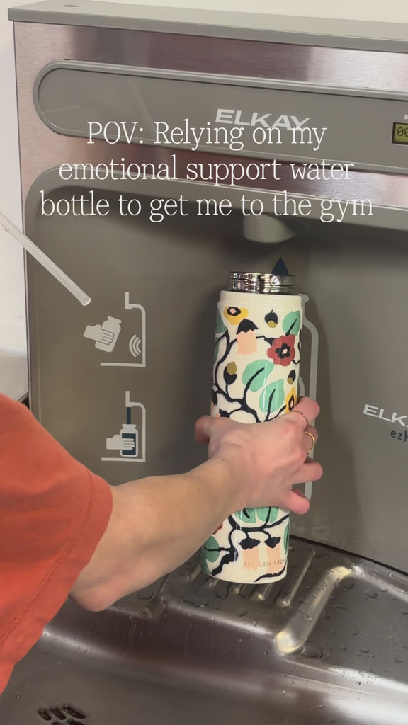 model filling up colorful waterbottle