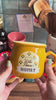 model showcasing yellow honey pot mug