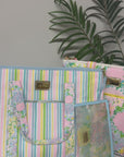 model showcasing colorful cooler totes